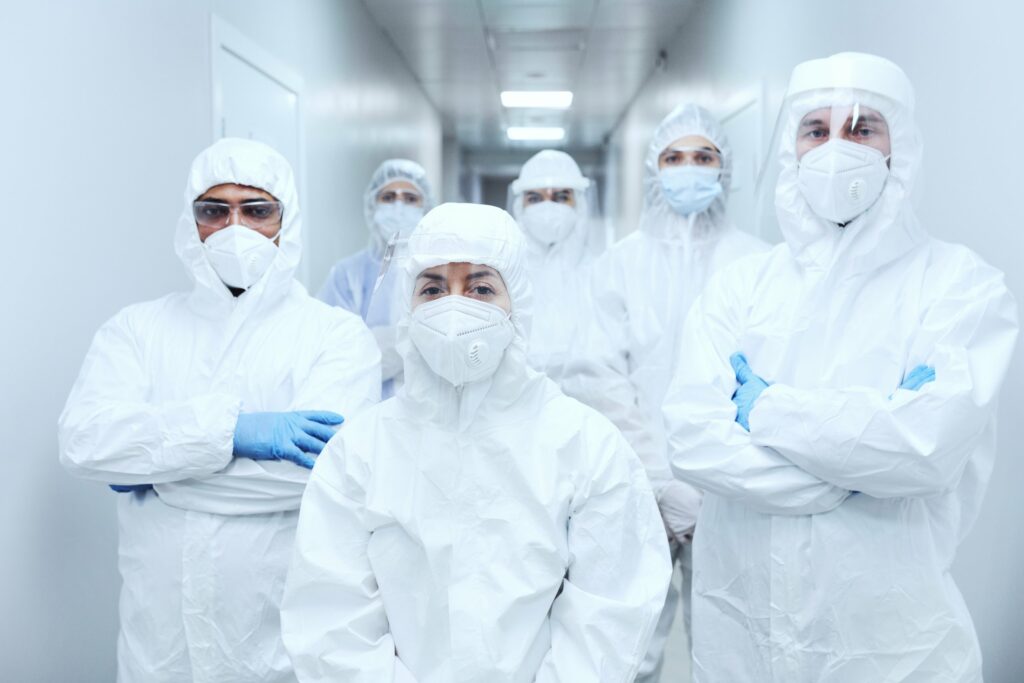 doctors-in-protective-uniforms-at-hospital-DYJKZ9F-scaled