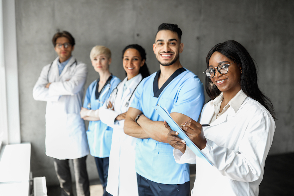 10 Questions To Ask Before Buying Staff Uniforms 1 international-team-of-doctors-having-morning-breef-2022-01-19-00-03-28-utc