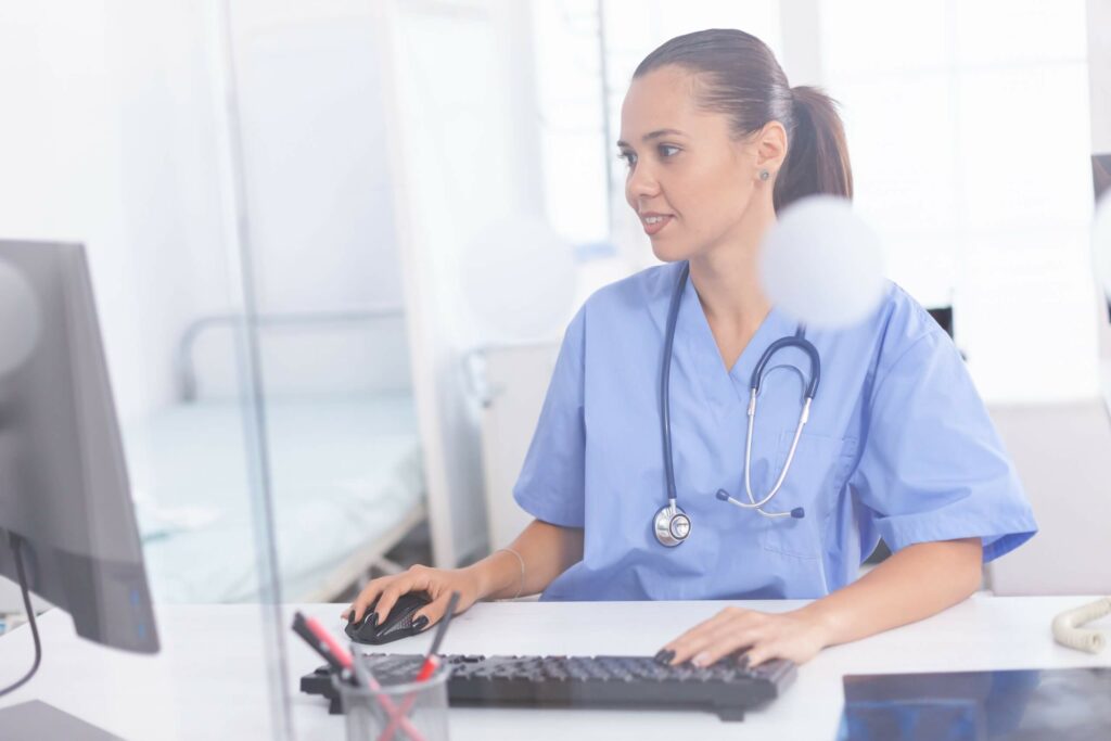 medical-practitioner-using-computer-ZFG69YD-scaled