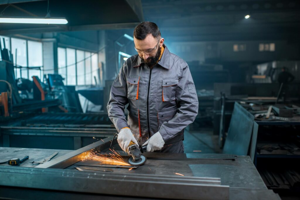 metal-industry-worker-at-factory-in-work-wear-7CABWW7-scaled