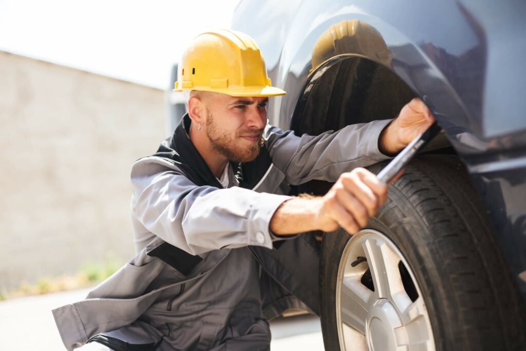 portrait-of-young-mechanic-in-work-clothes-and-har-NAKH647-scaled